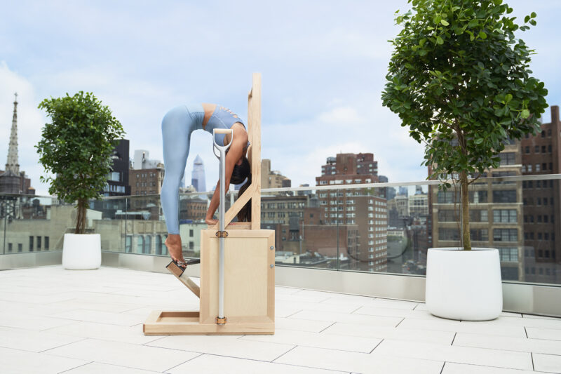 A picture of the woman working out on the wooden box